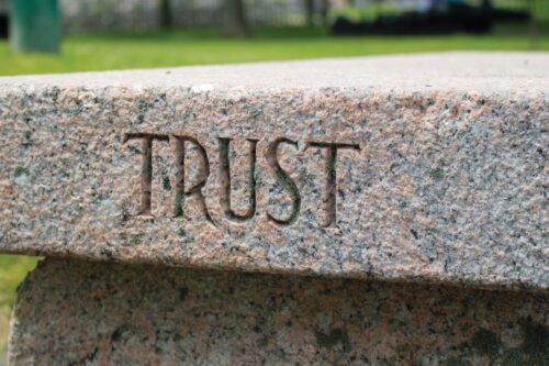 Trust Carved Into Stone Photo